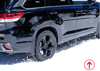 Image of black SUV driving on snowy road