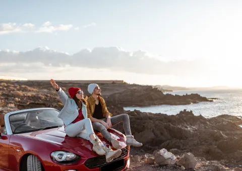 People sitting on car