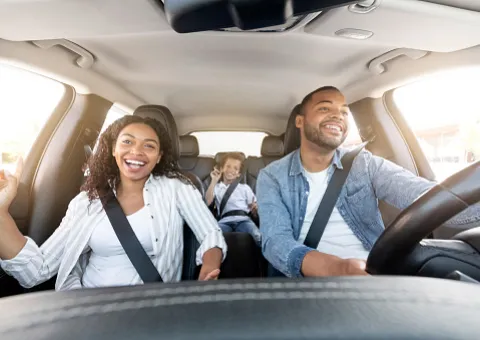 People sitting on car
